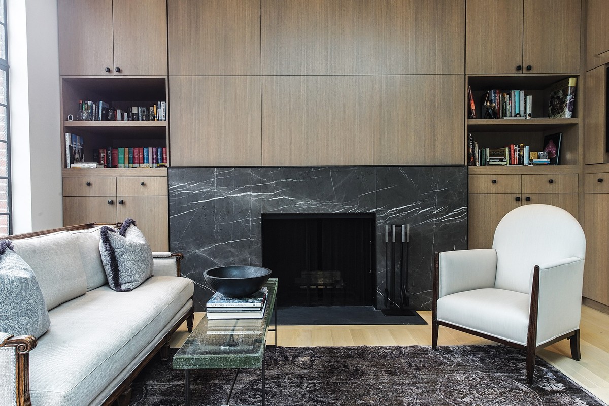 Granite adds a nice touch to a fireplace designed by Maneli Wilson.