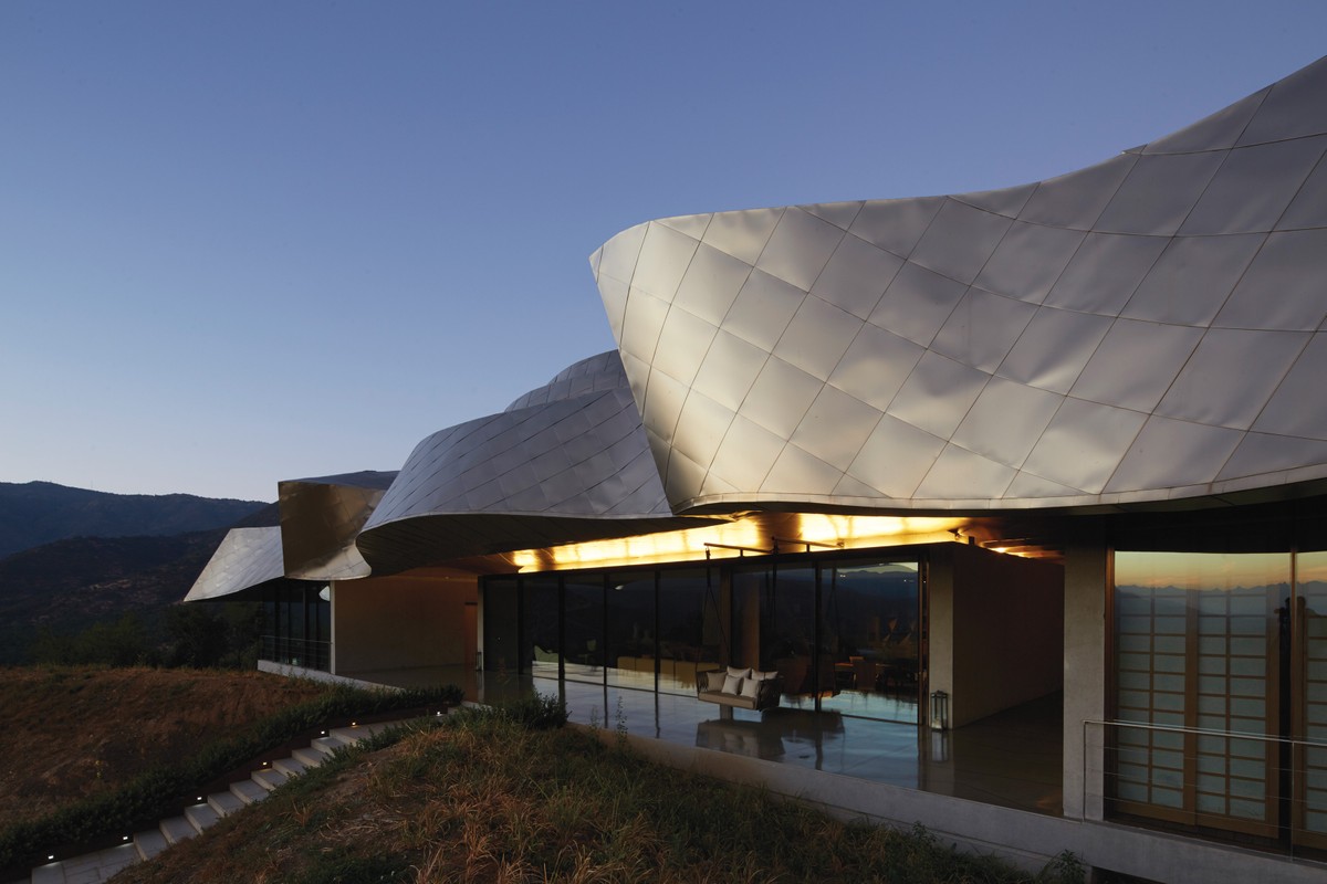 Its namesake winery and hotel, has a floating, structural roof made of titanium and bronze
