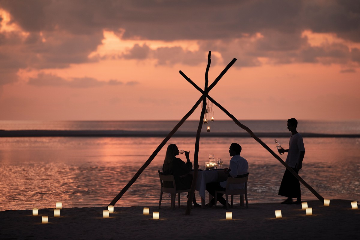 Beachfront sunset dining at COMO Cocoa Island in the Maldives